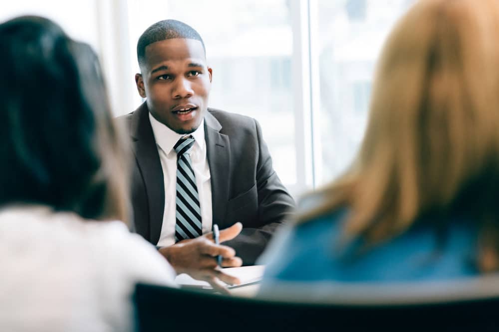 Bull Consult consultant in a strategy meeting with clients